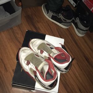 Jordan Retro 4’s Fire Red beat up for project shoe